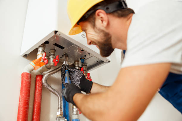 Licensed plumber reviewing pricing estimate with Medford MA homeowner